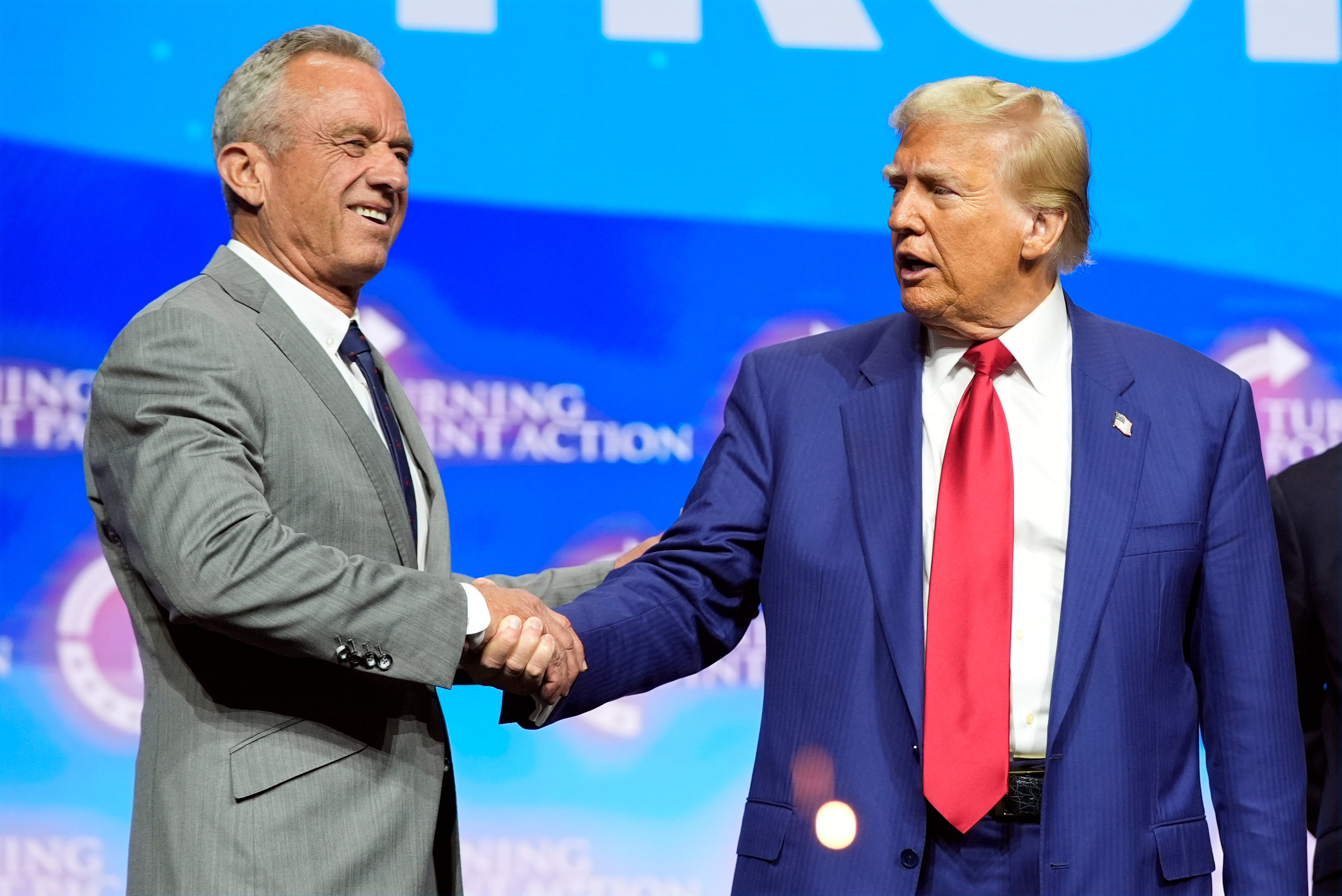 Trump shaking hands at campaign event