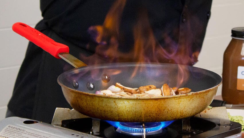 Mushrooms cooking in wine sauce