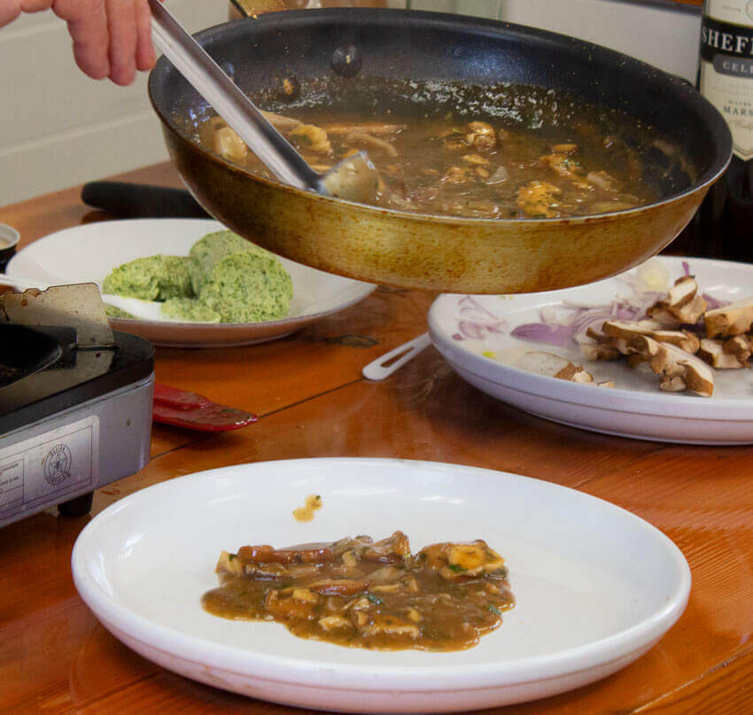 Pouring mushroom sauce onto plate