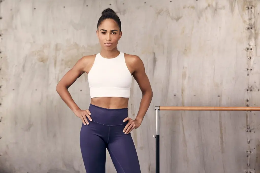 Woman doing fitness pose outdoors