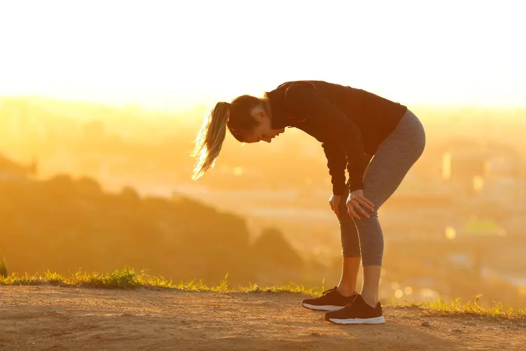 Woman bent over exercising