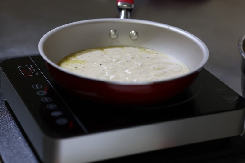 Red sauce simmering in pan