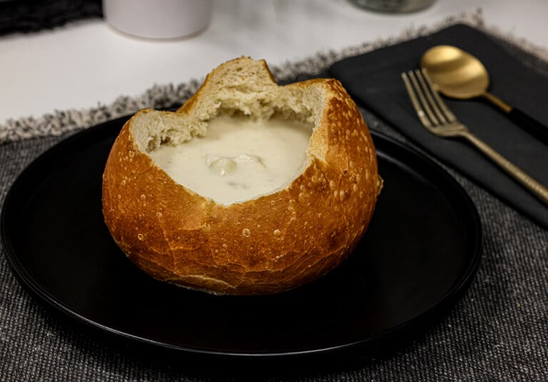 Creamy clam chowder in bread bowl