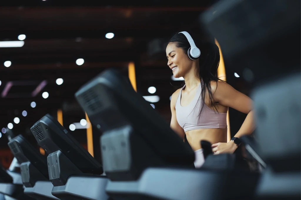 Woman exercising on gym treadmill