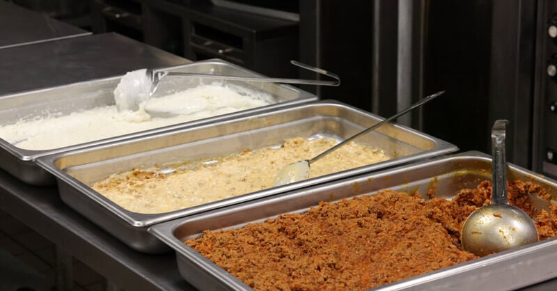 Lasagna ingredients laid out in trays