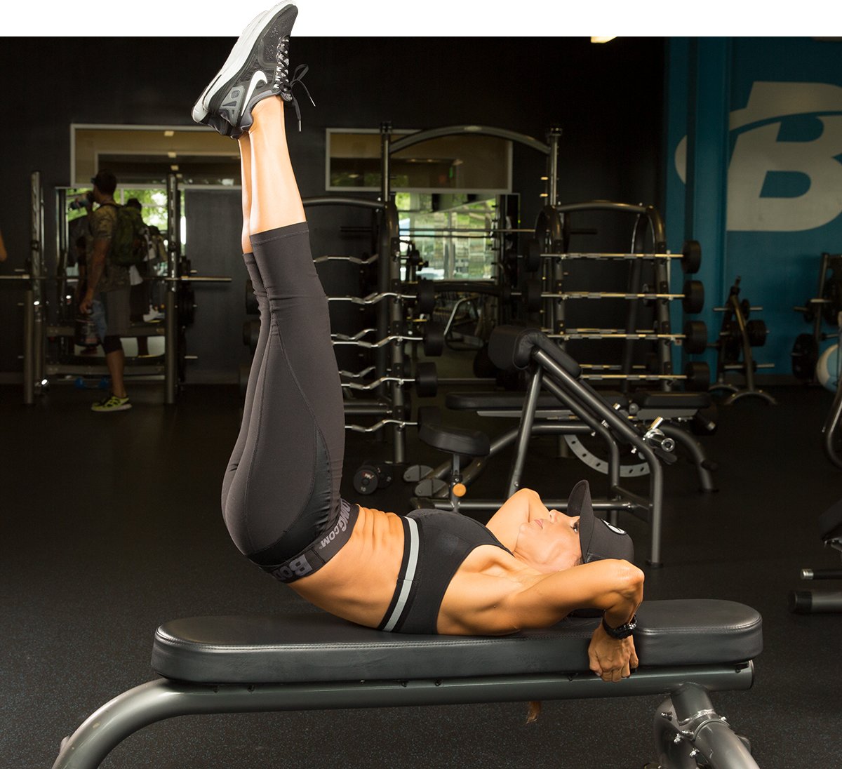 Woman doing abdominal workout on bench