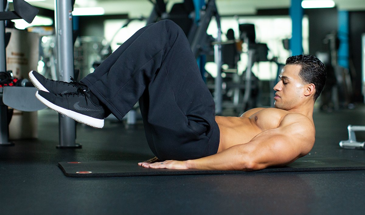 Man performing crunches on floor