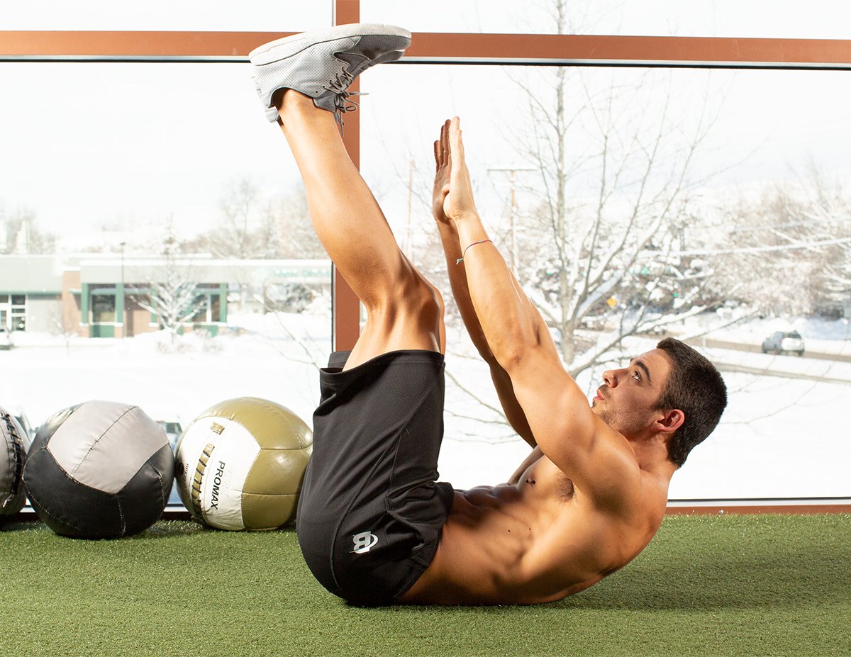 Man doing crunches on floor