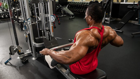 Man doing rowing exercise at gym