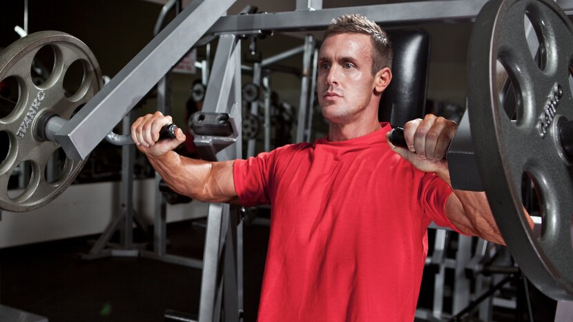 Man using chest press machine