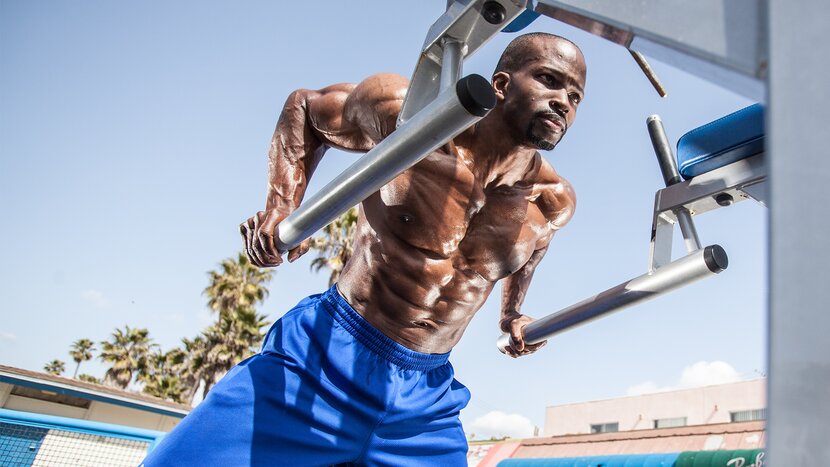 Man performing dips on bars