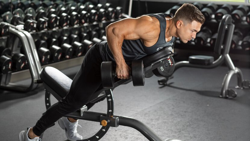 Man performing dumbbell rear delt row