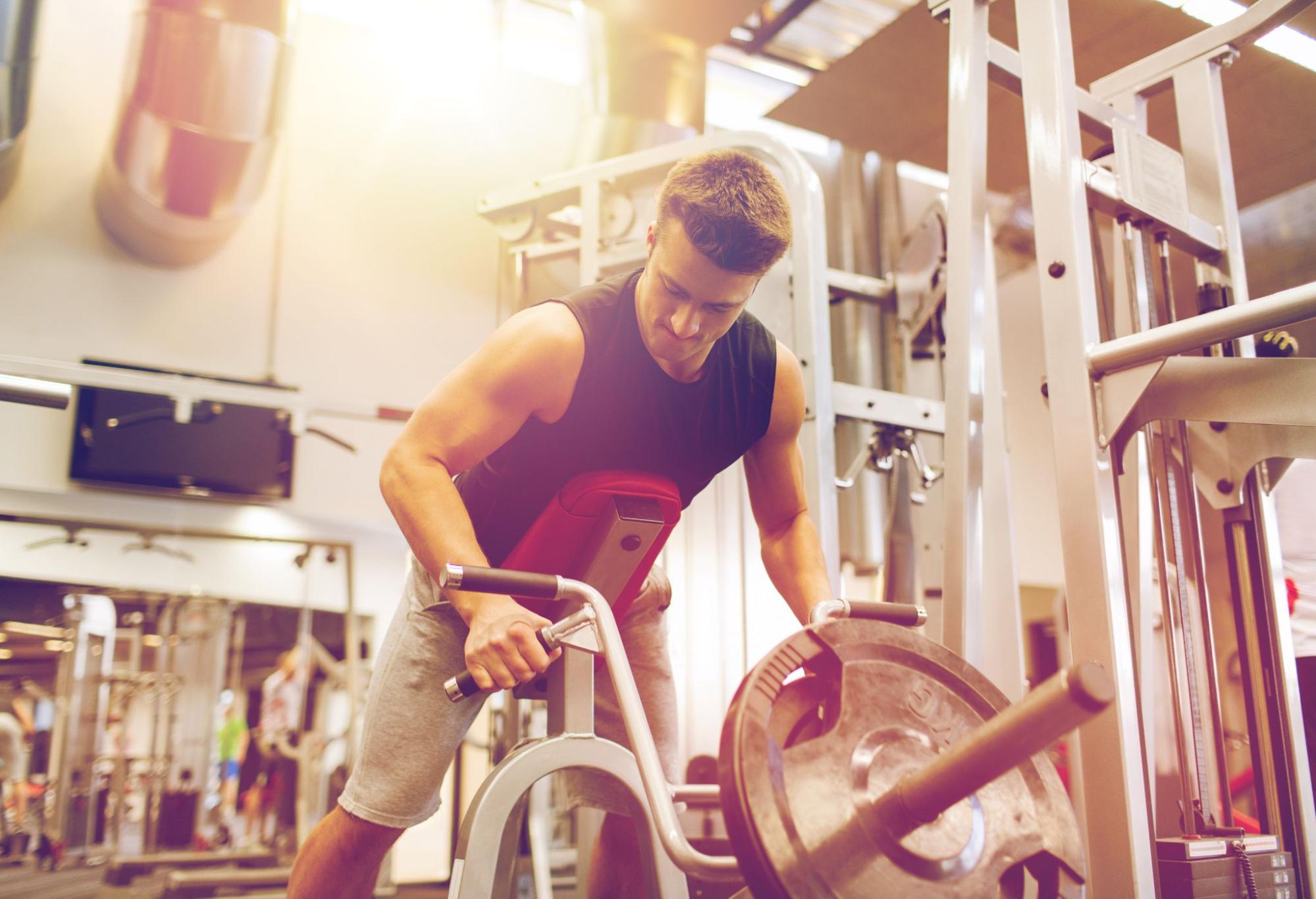 Man lifting dumbbells at gym