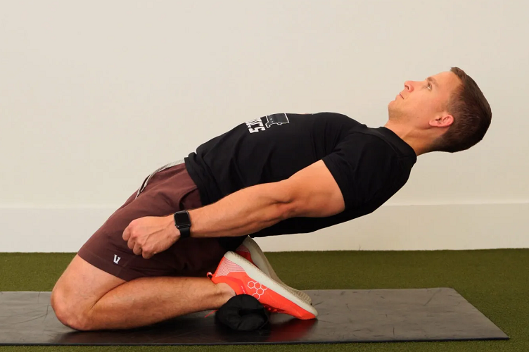 Man doing yoga on floor mat