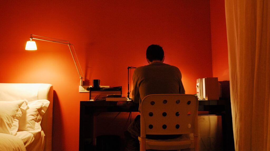 Man at desk during nighttime