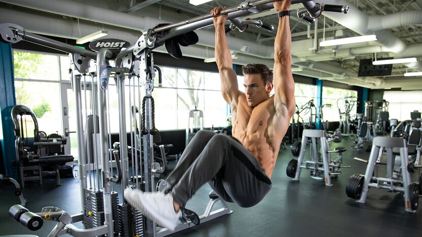 Man performing hanging knee raises