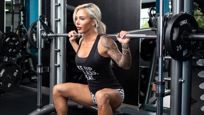 Woman exercising on leg press machine