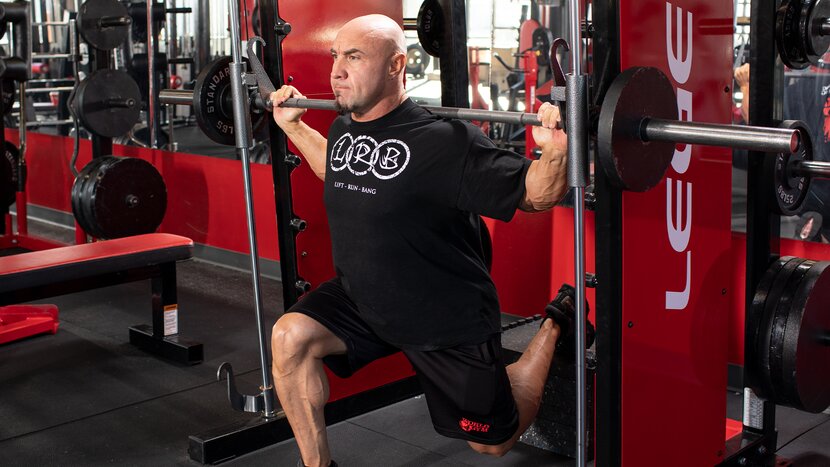 Man performing split squat