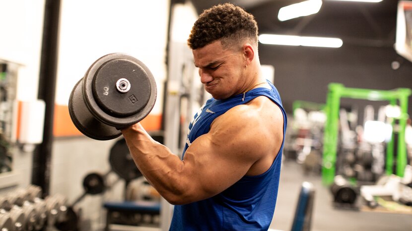 Man performing dumbbell bicep curl