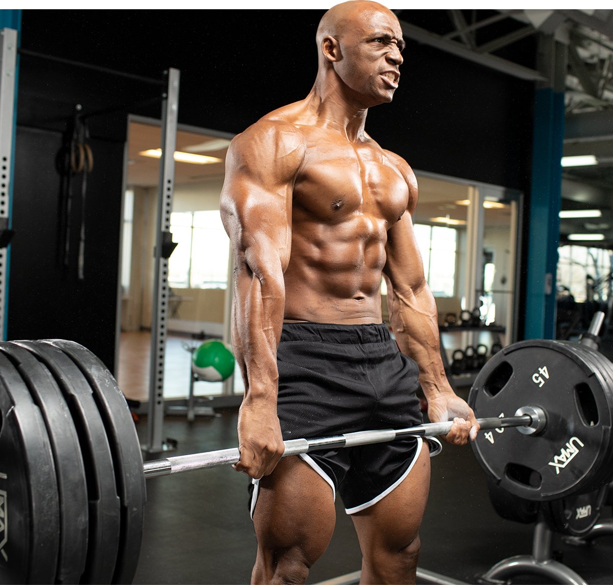 Man performing barbell back exercise