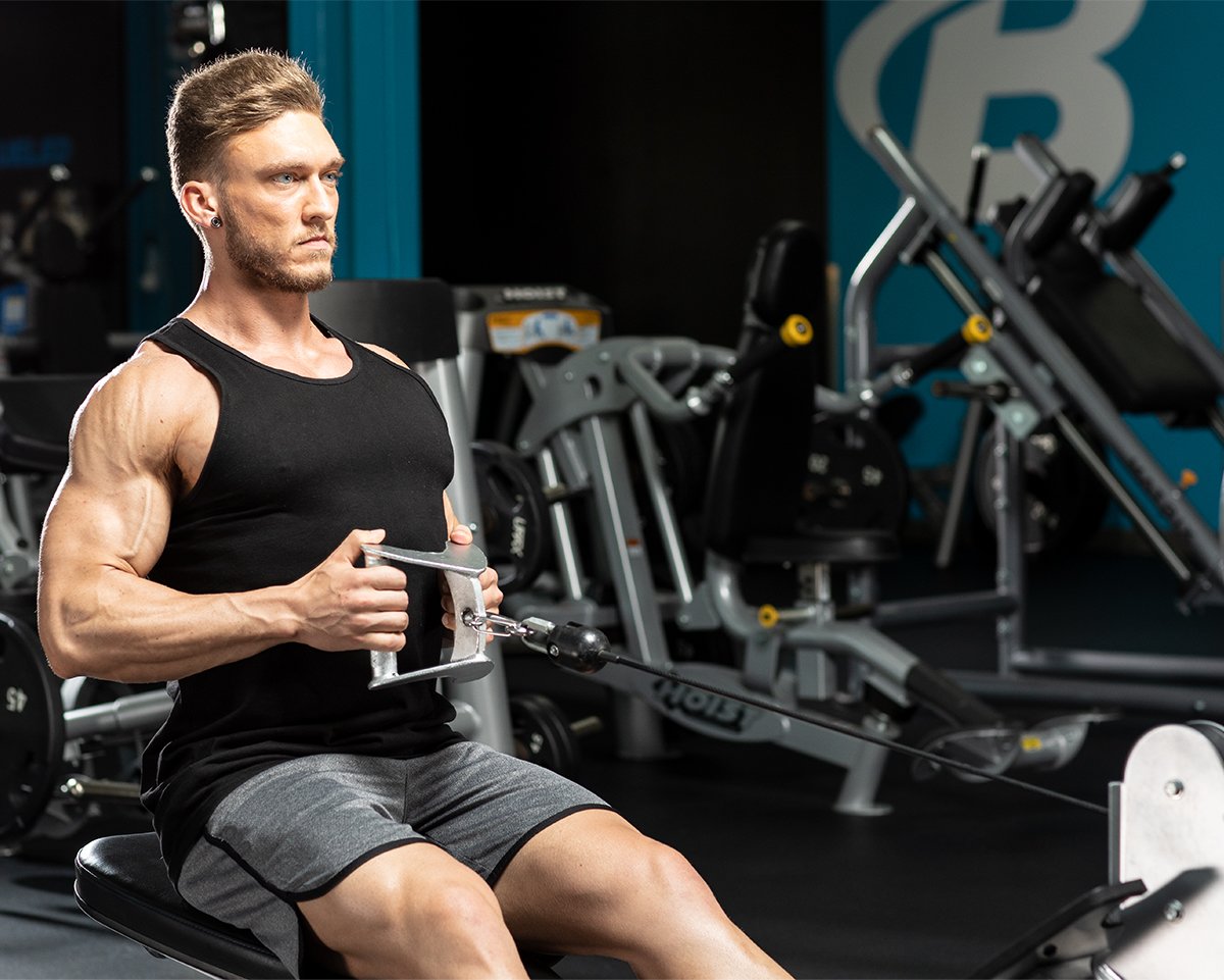 Man doing seated cable row exercise