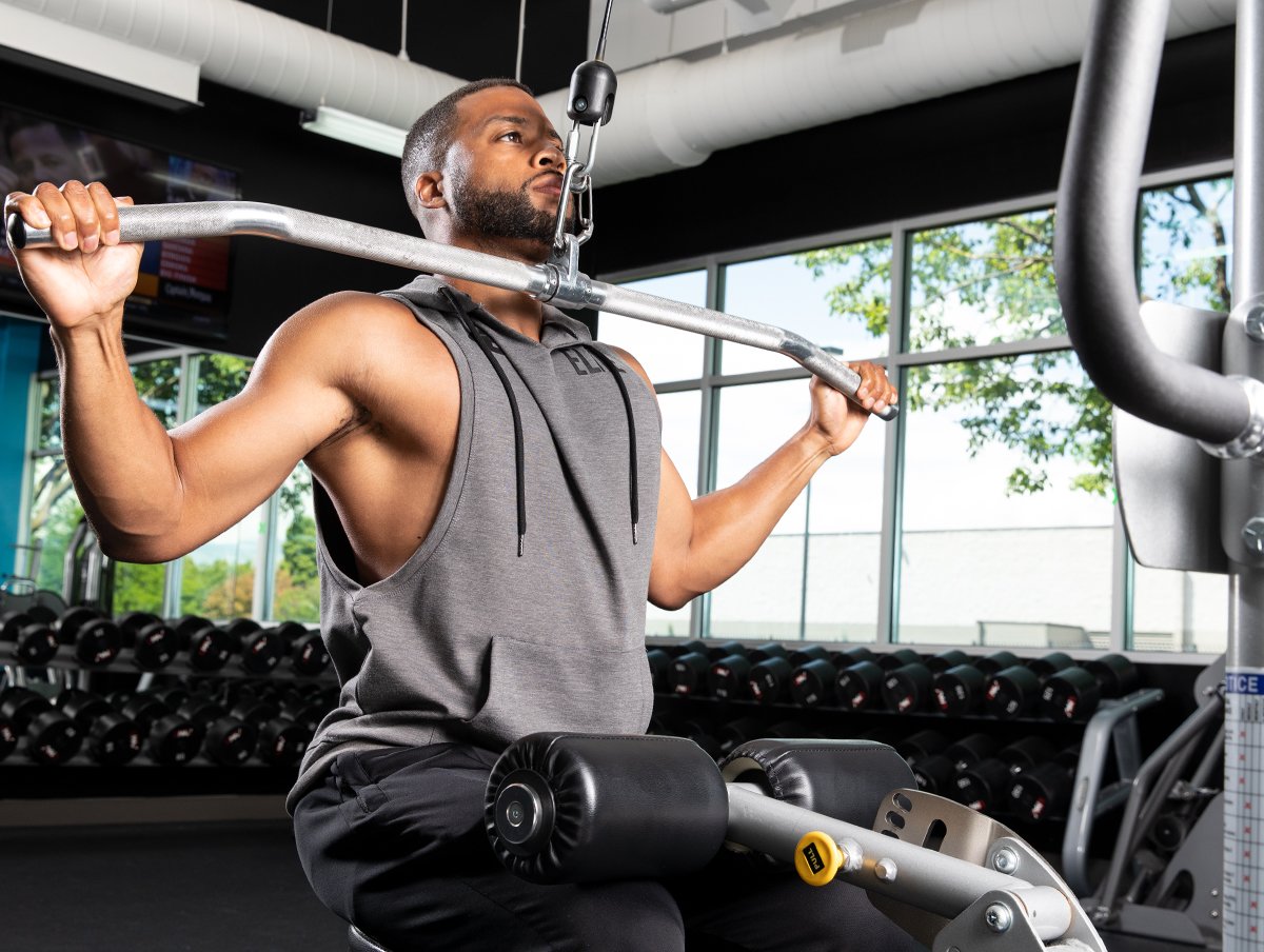 Man doing lat pulldowns in gym