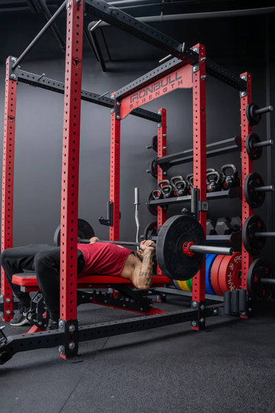 Man using power rack for weightlifting