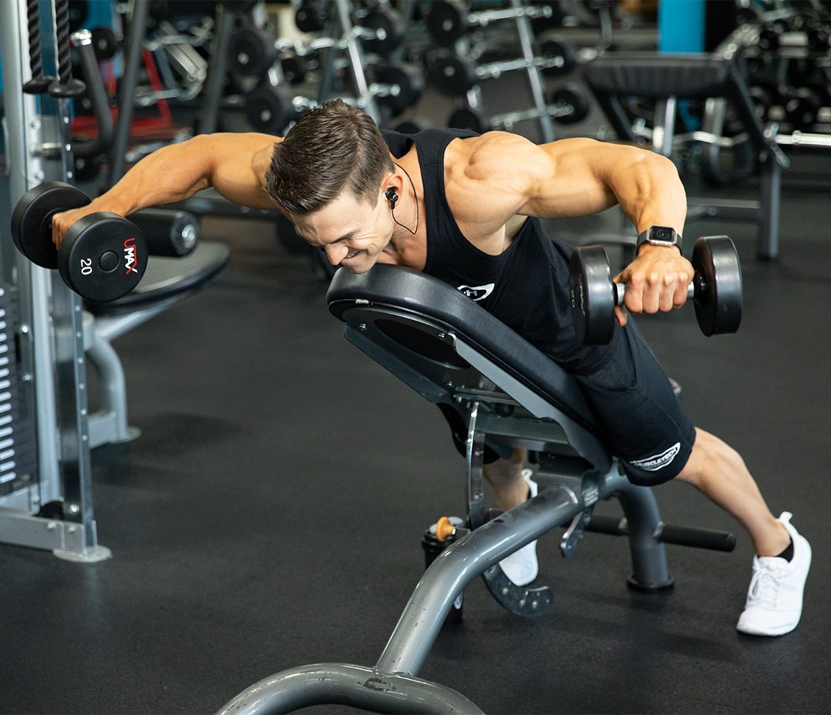 Man doing shoulder workout with dumbbells