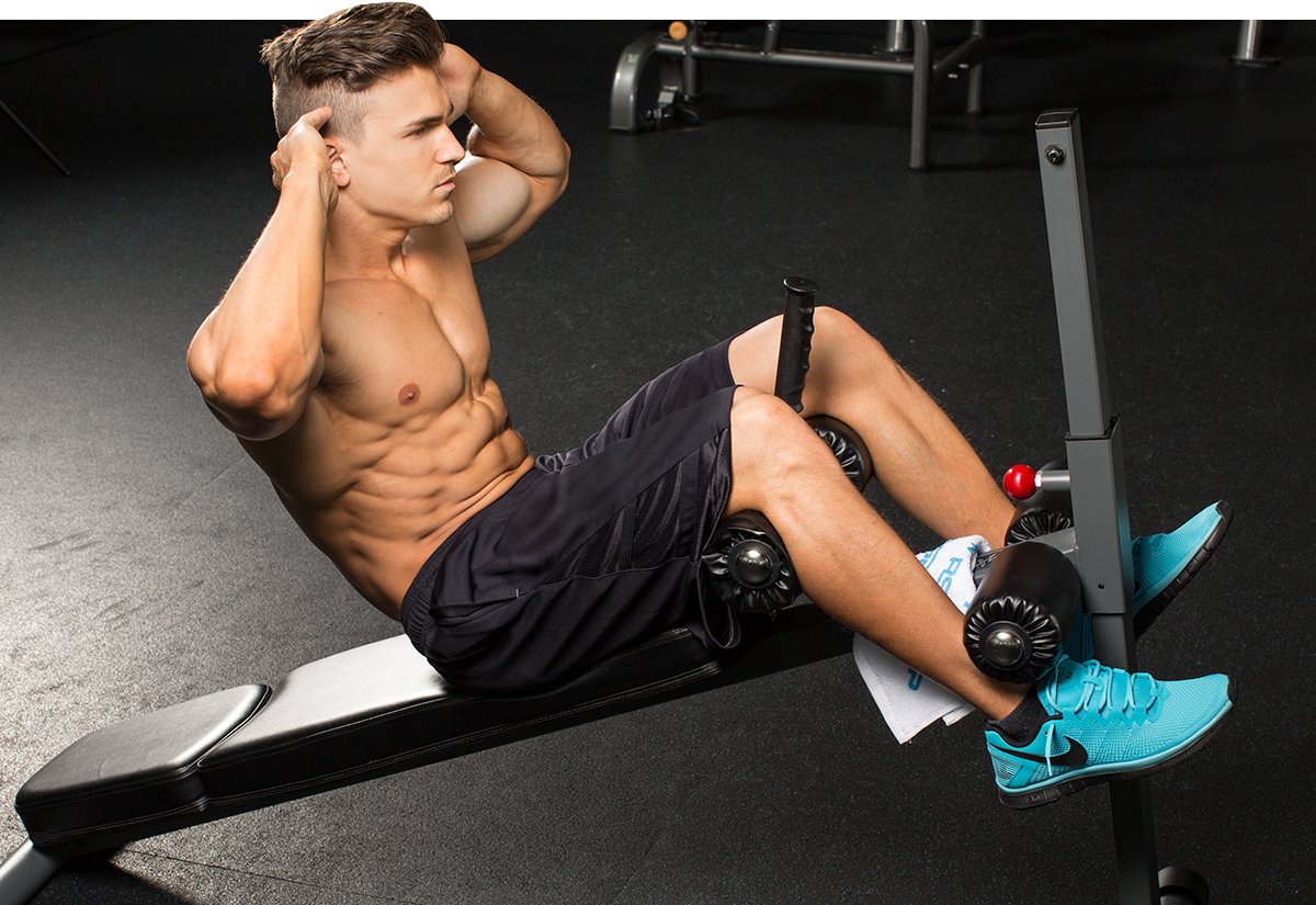 Man doing core exercises on bench