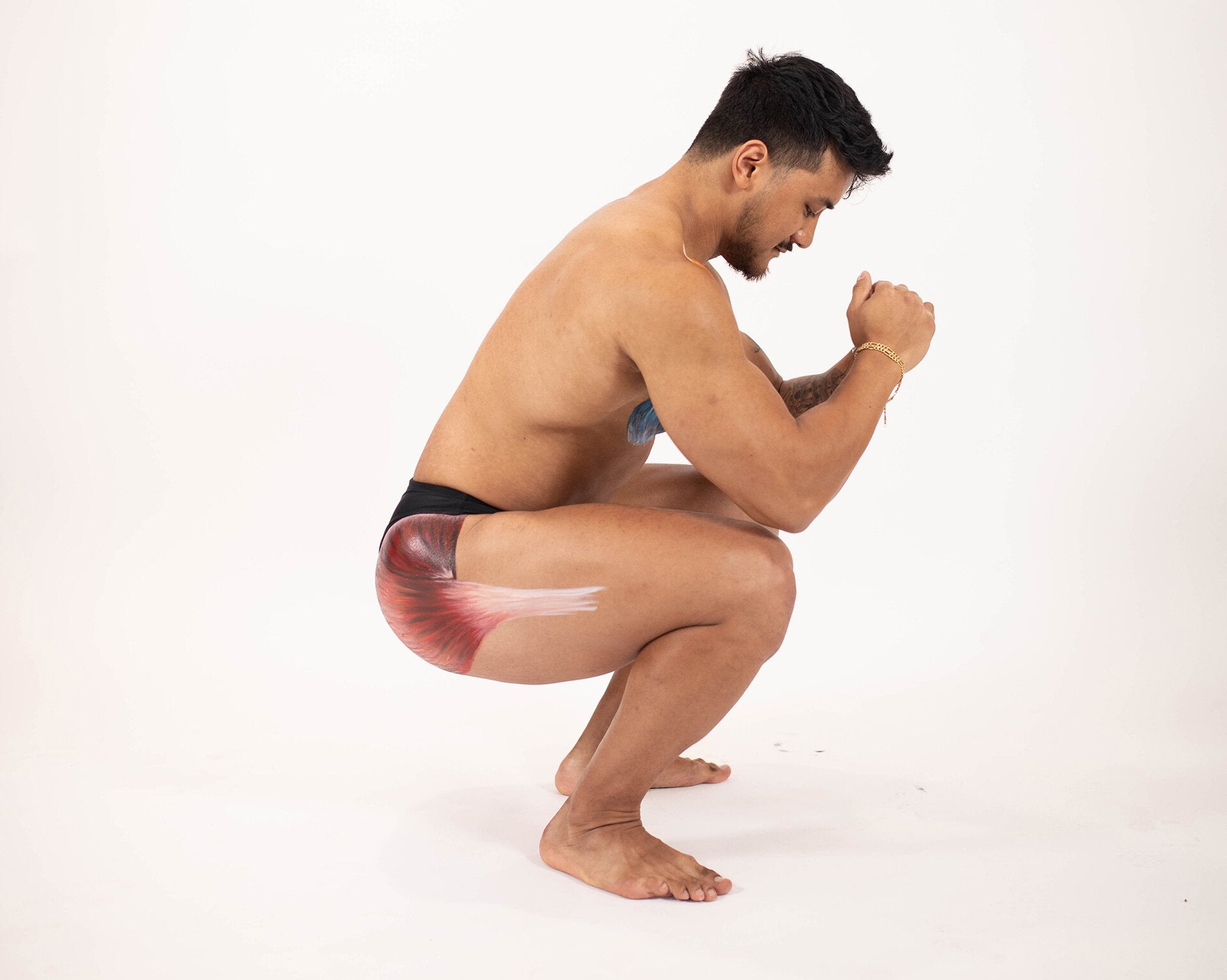 Man squatting to target glutes