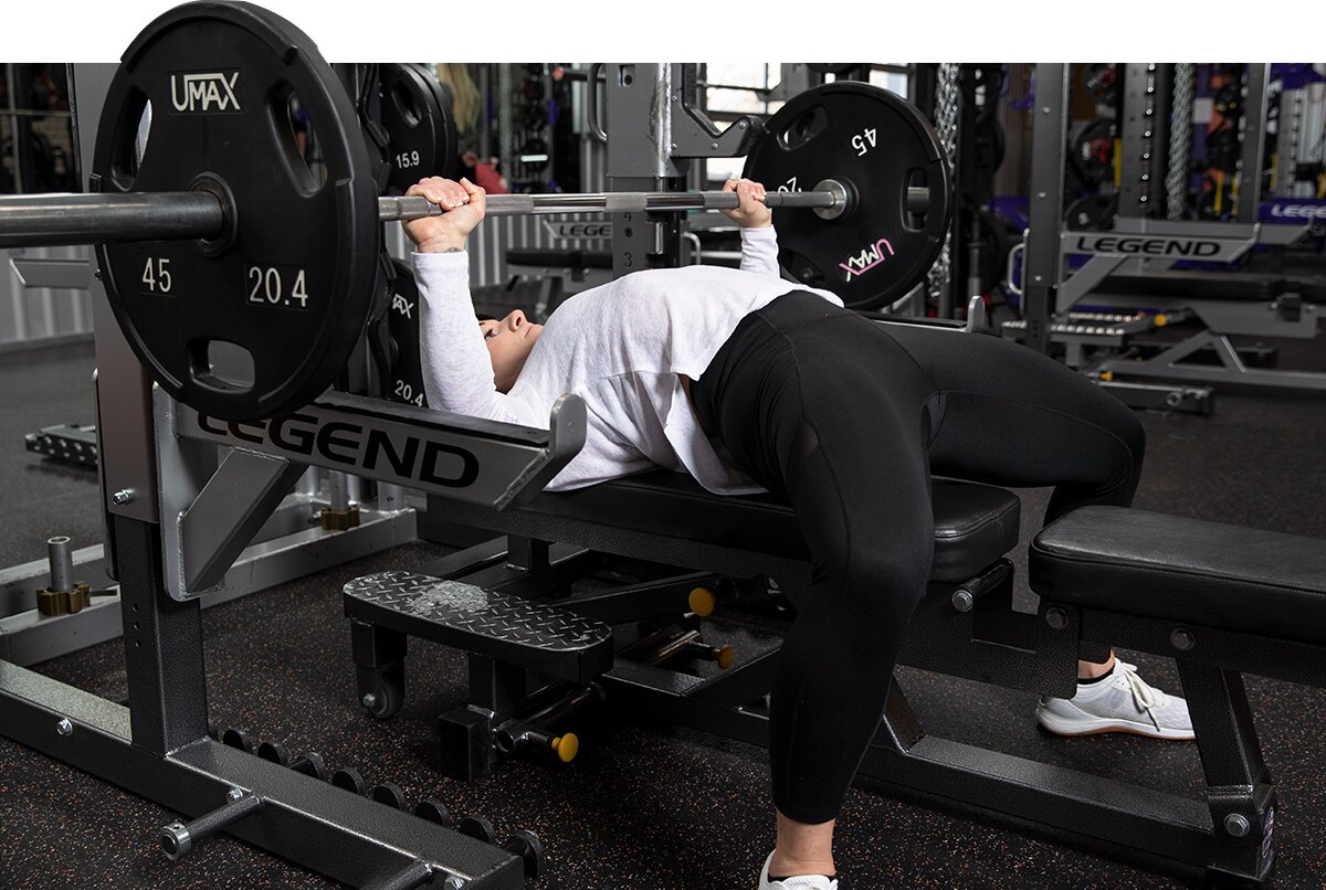 Woman performing dumbbell chest press