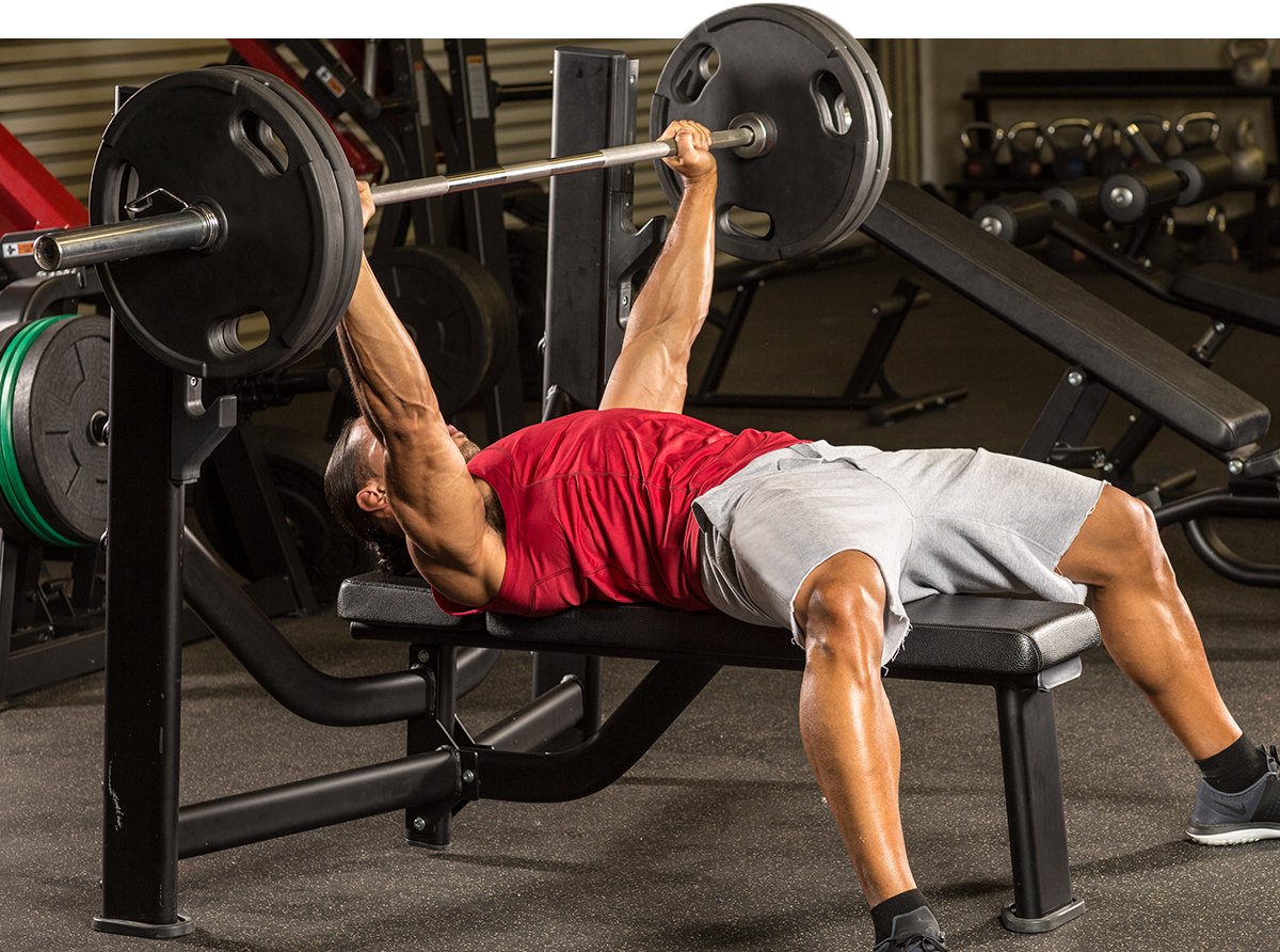 Man bench pressing with barbell