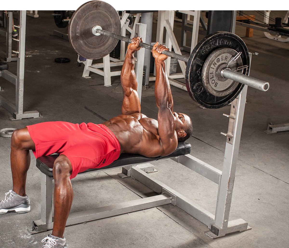 Man bench pressing with barbell