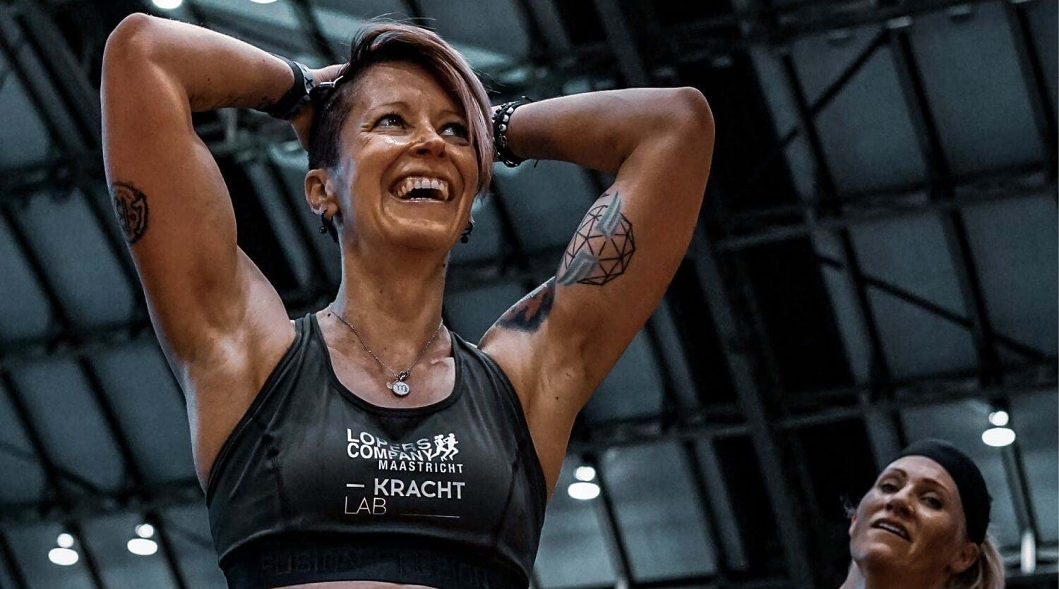 Woman exercising in black sports bra