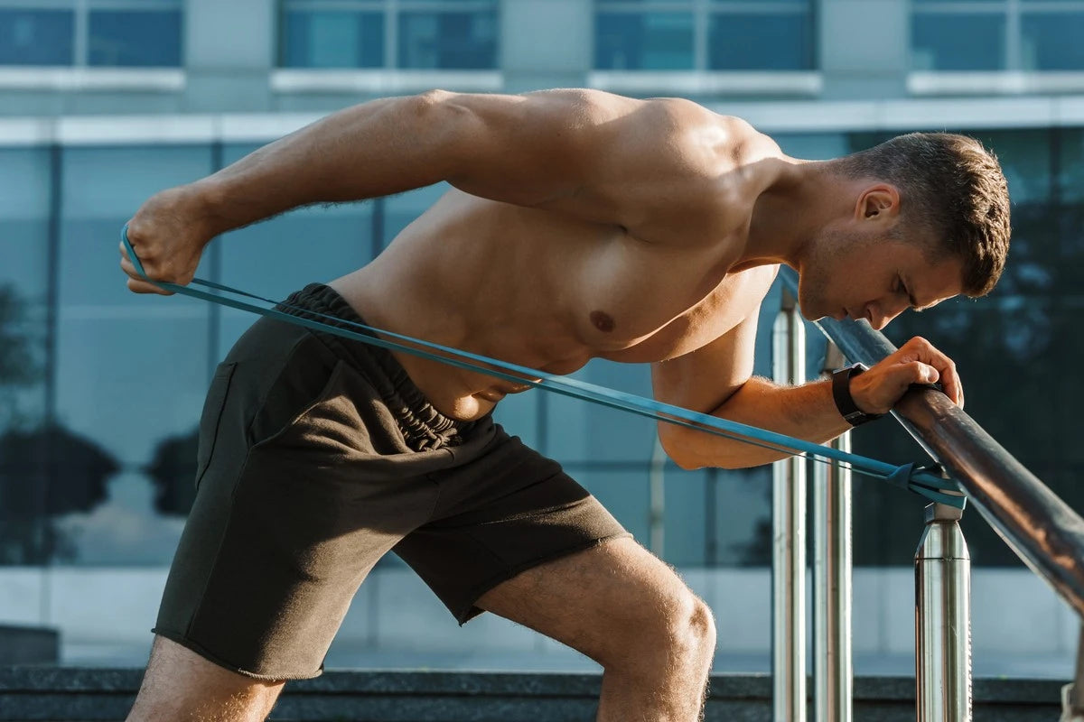 Man doing tricep workout with band