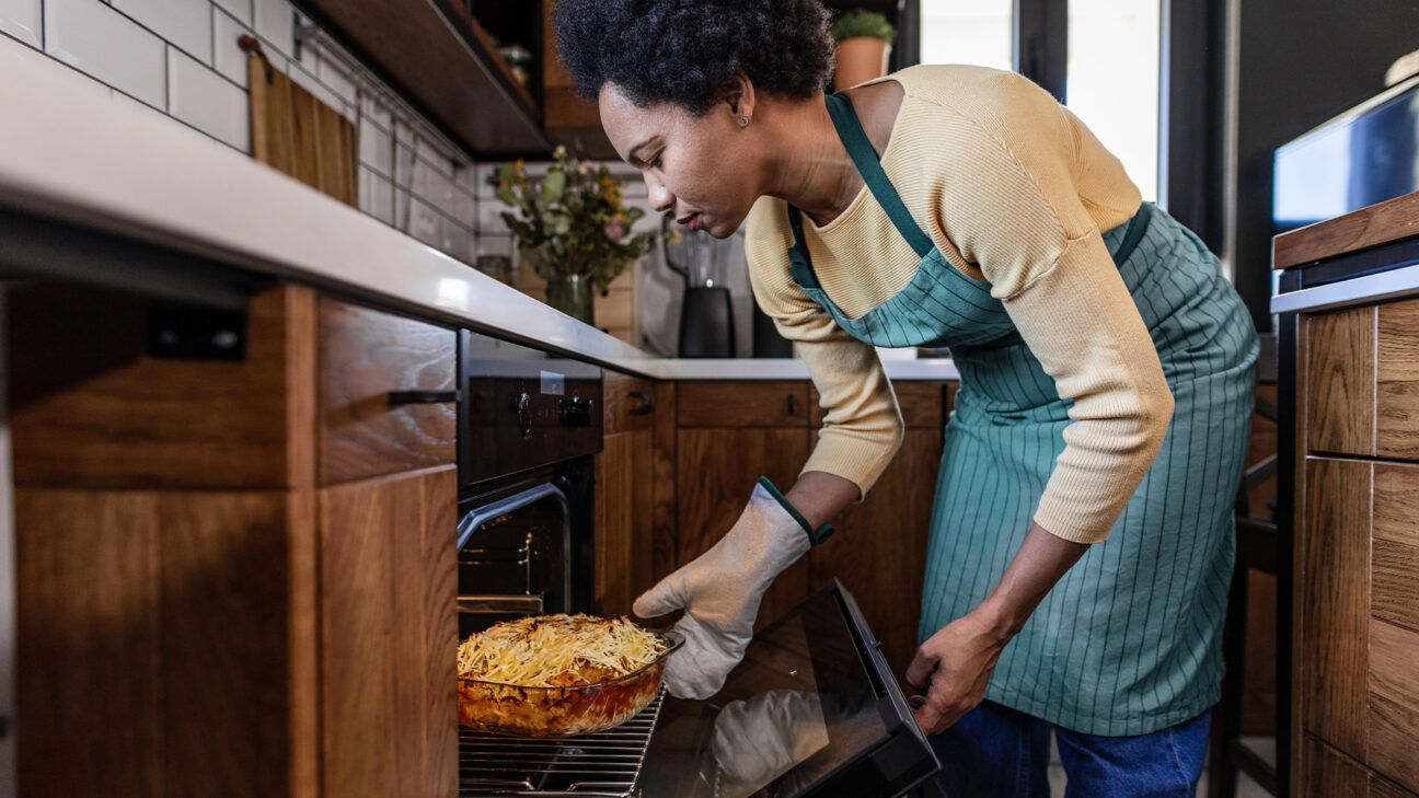 Woman taking out mac and cheese