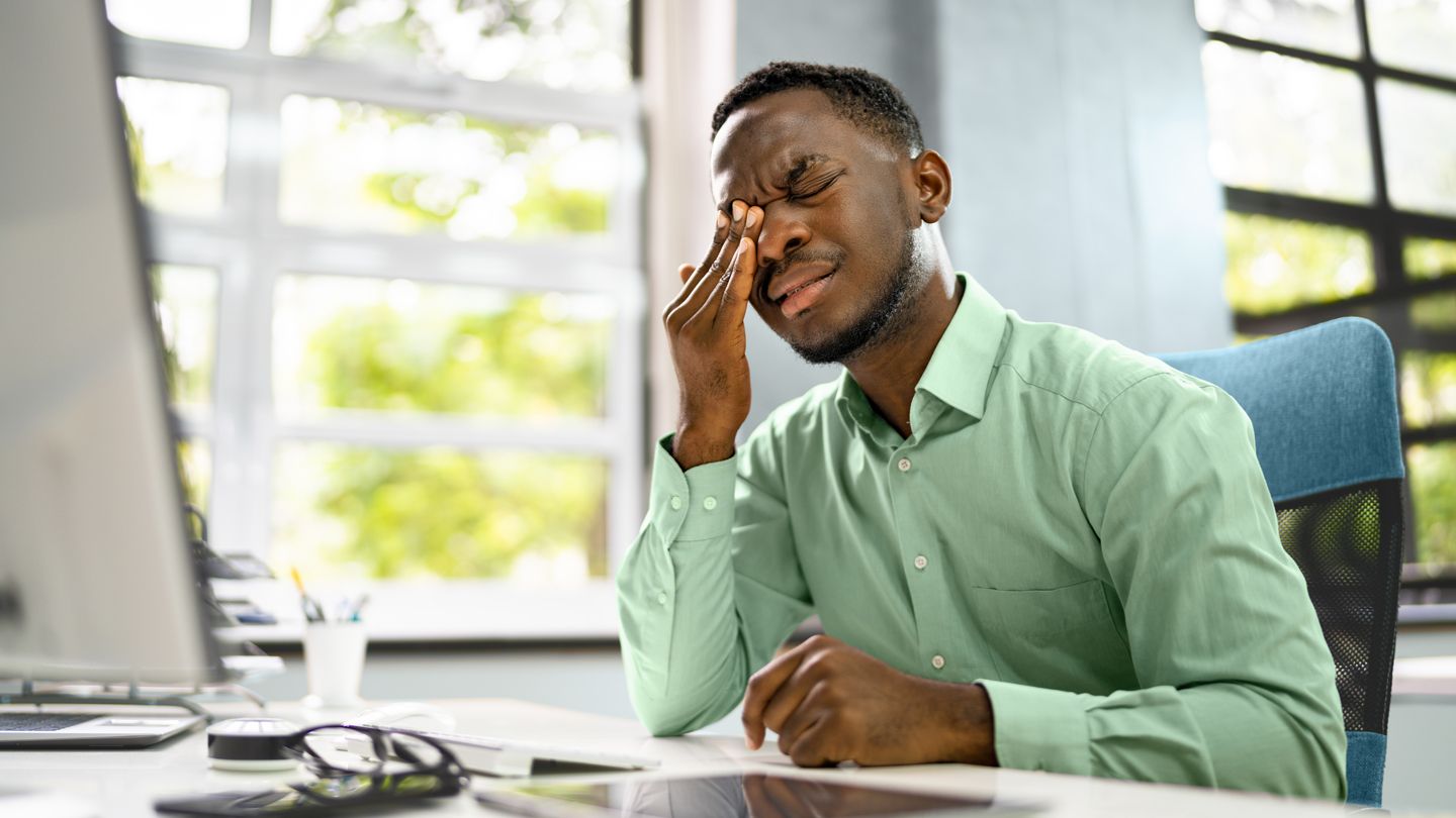 Man holding head in pain