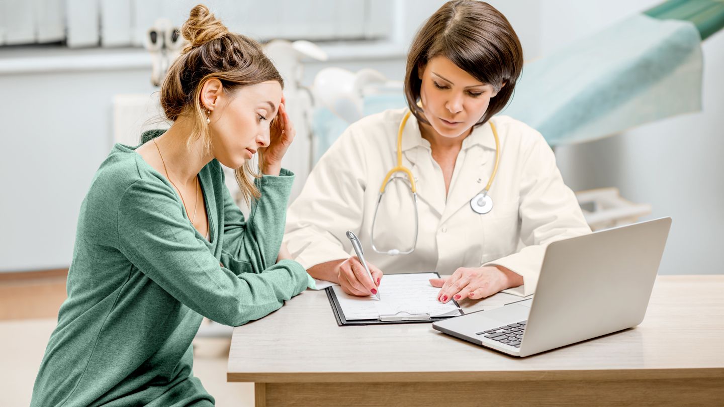 Doctor consulting patient about vaginal health