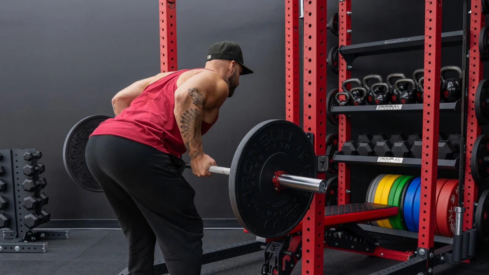 Man performing squat in power rack