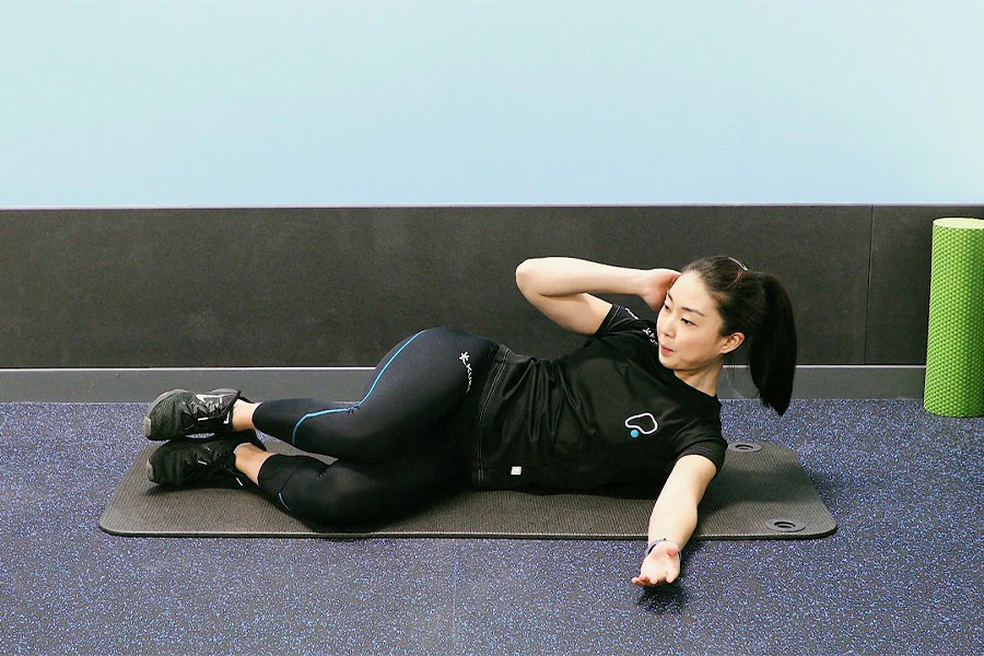 woman performing leg lift exercise