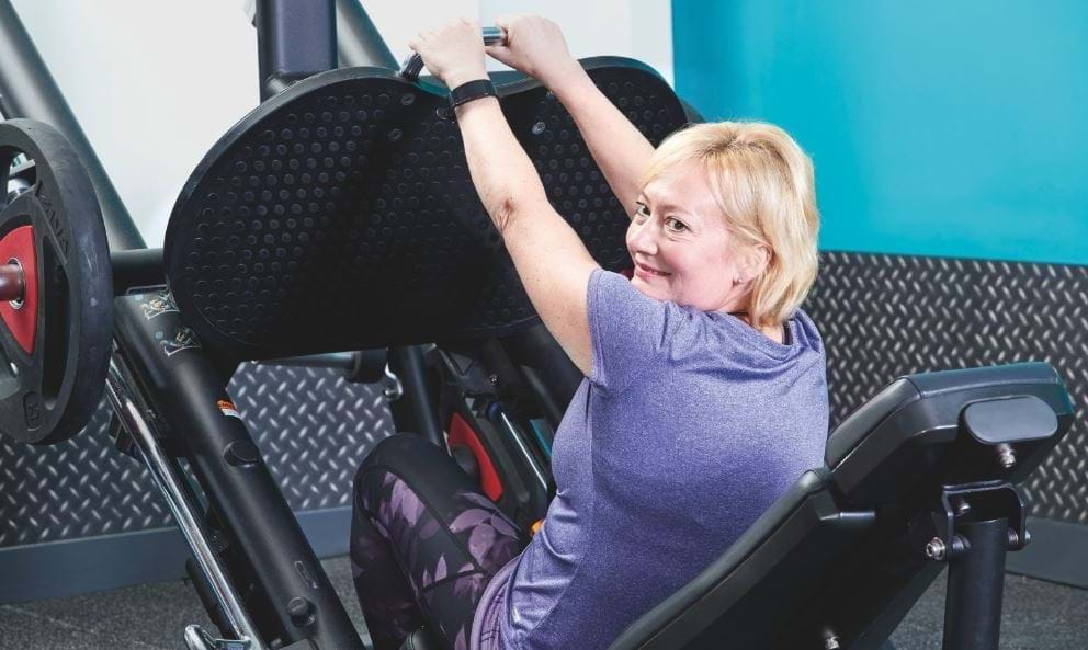 Senior woman performing seated exercises