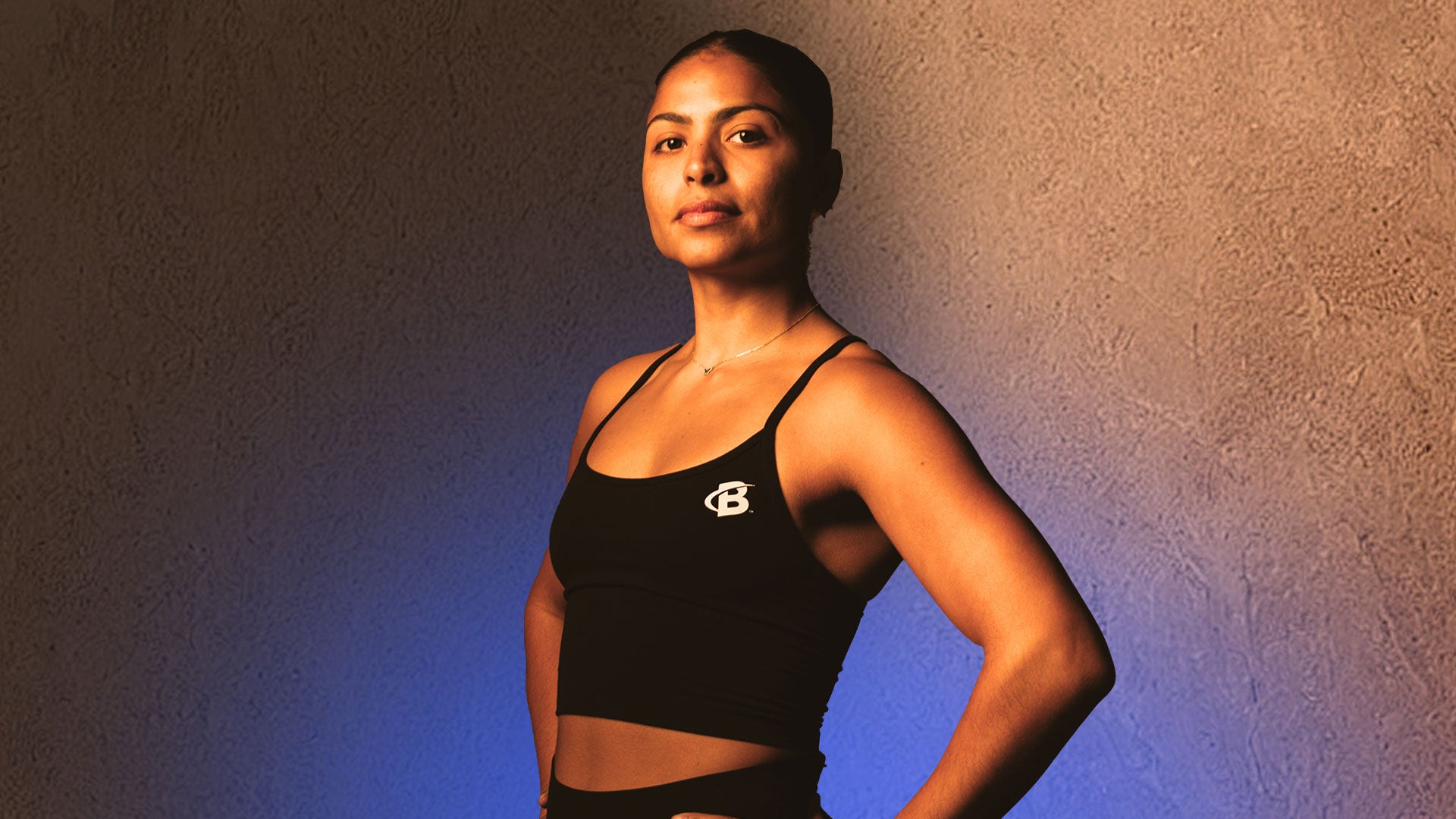 Woman wearing black tank top headshot