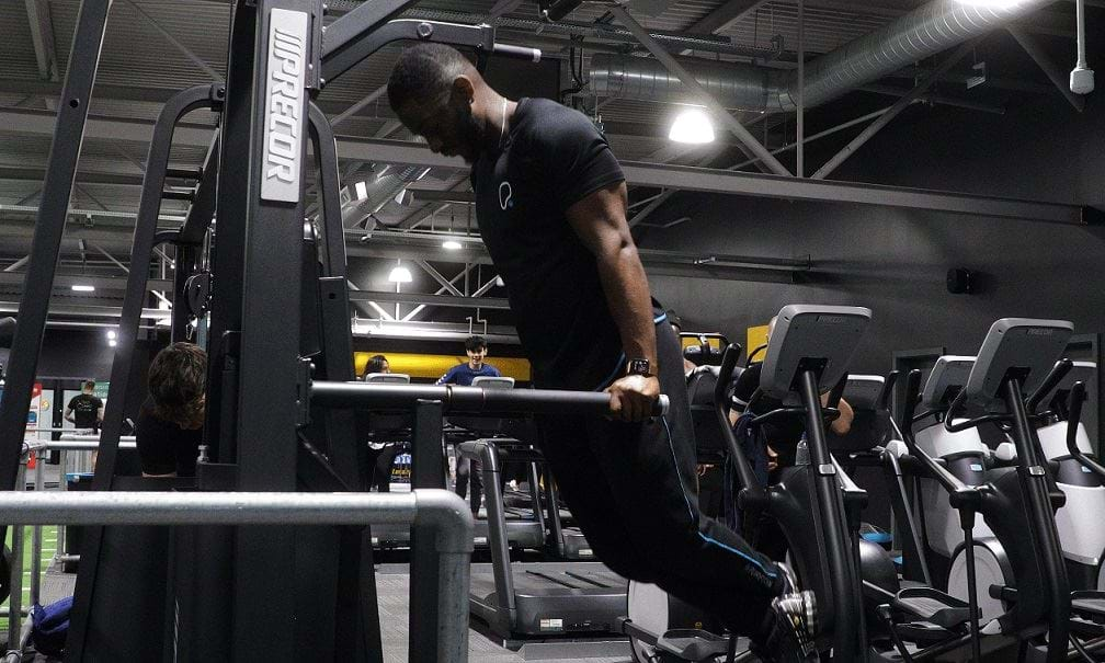 Man performing chest dips