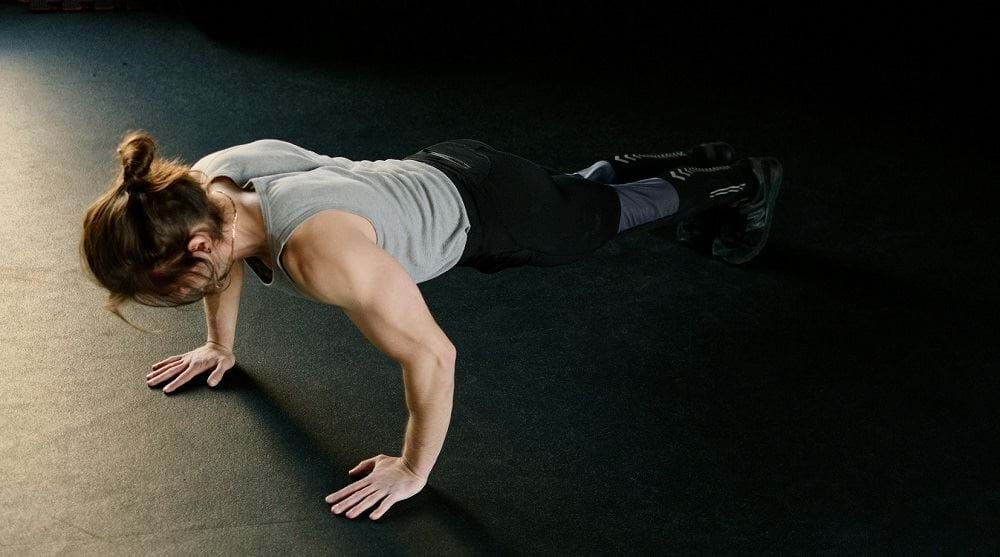 Man doing pushup on gym floor