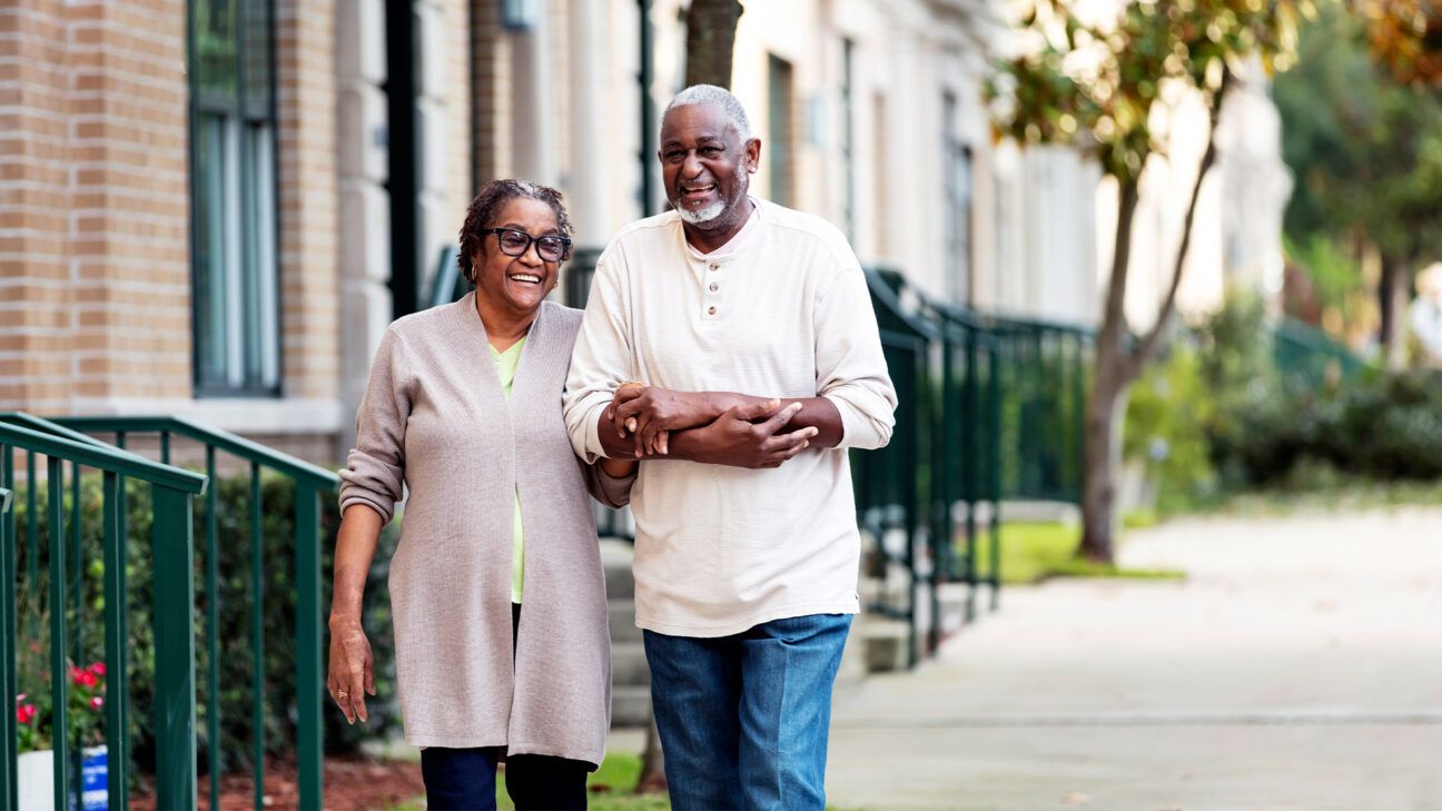 Senior couple walking together outside