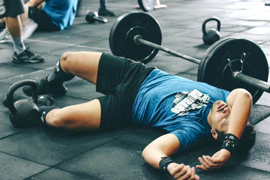 Man doing floor hip stretch exercise