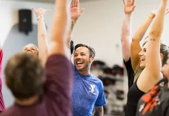 Group fitness class stretching exercises