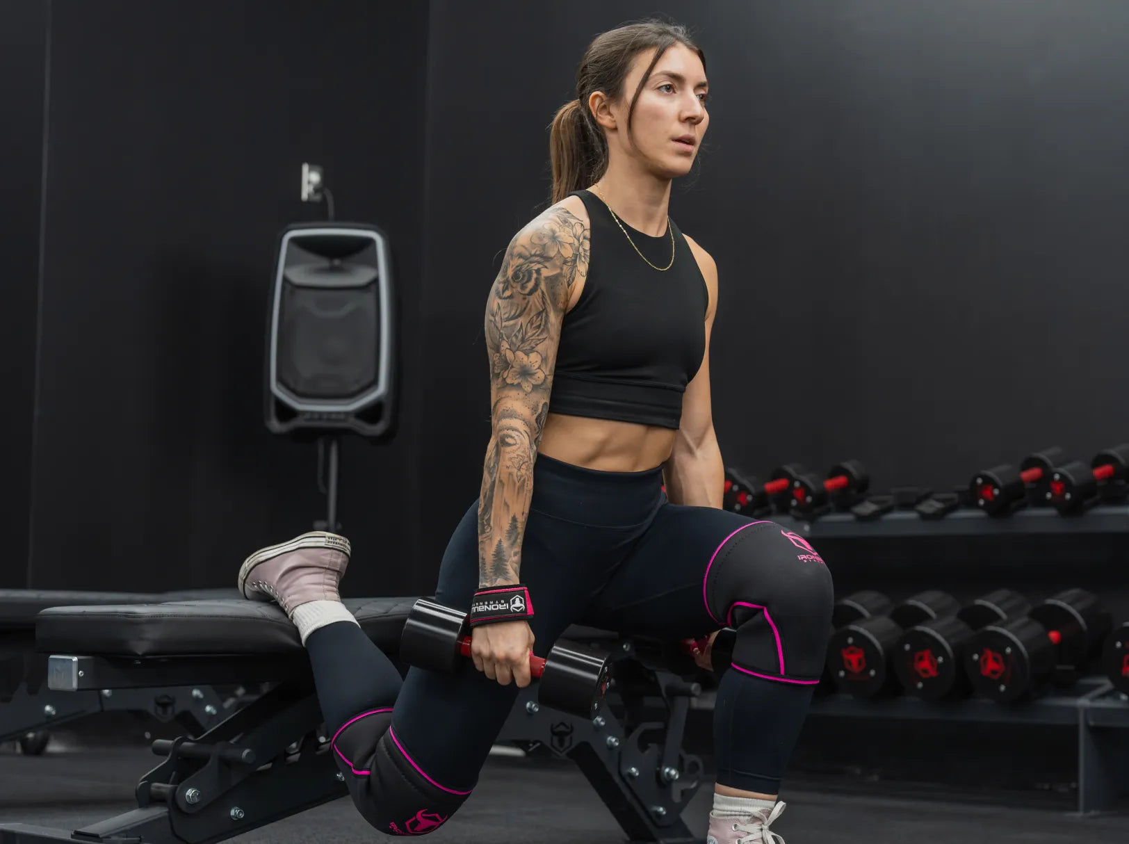 Female weightlifter training in gym