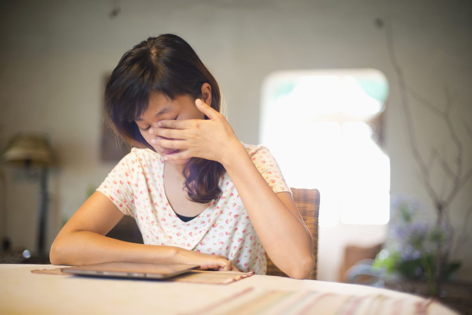 Woman using tablet in blue room