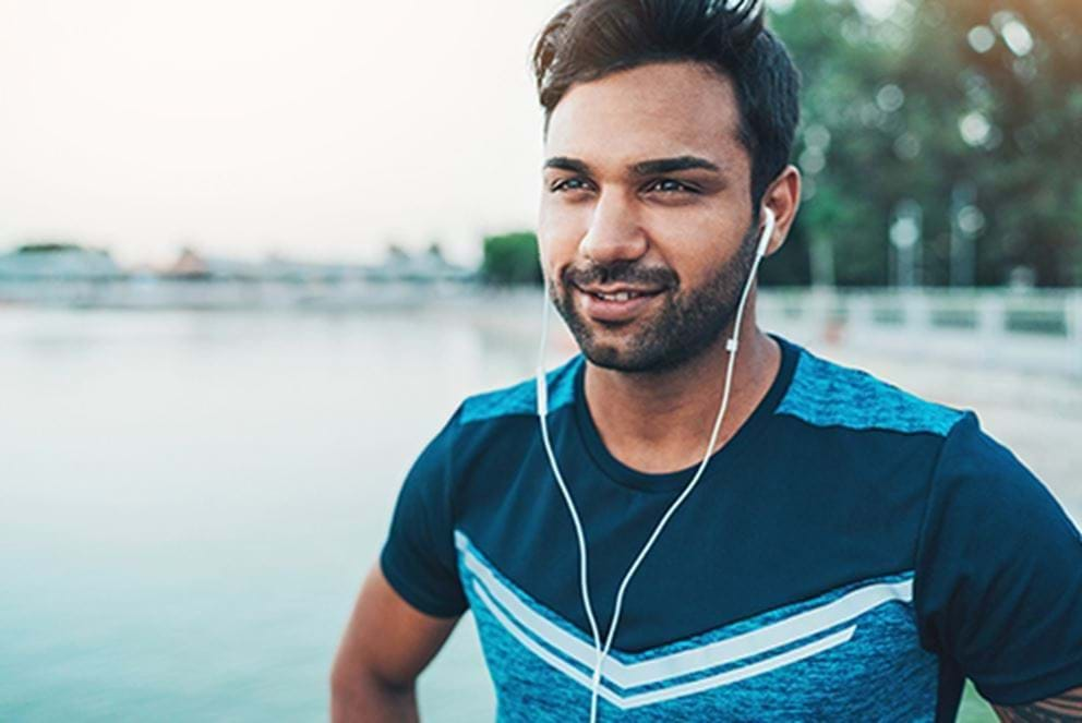 Runner wearing earbuds during workout